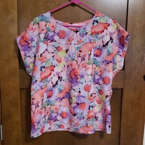 Polyester floral print pull over short sleeved top.
